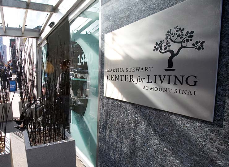 Gray sign on granite wall announcing the Martha Stewart Center for Living at Mount Sinai