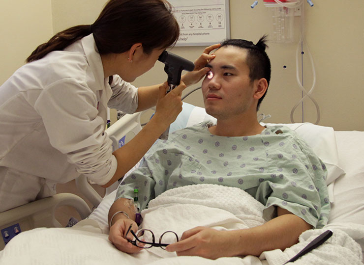 Doctor performing neurological exam on patient