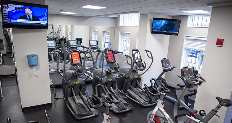 Stationary bicycles and elliptical machines in Aron Hall health fitness room
