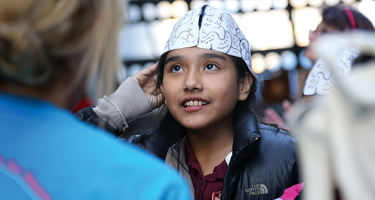Image of young girl with brain hat