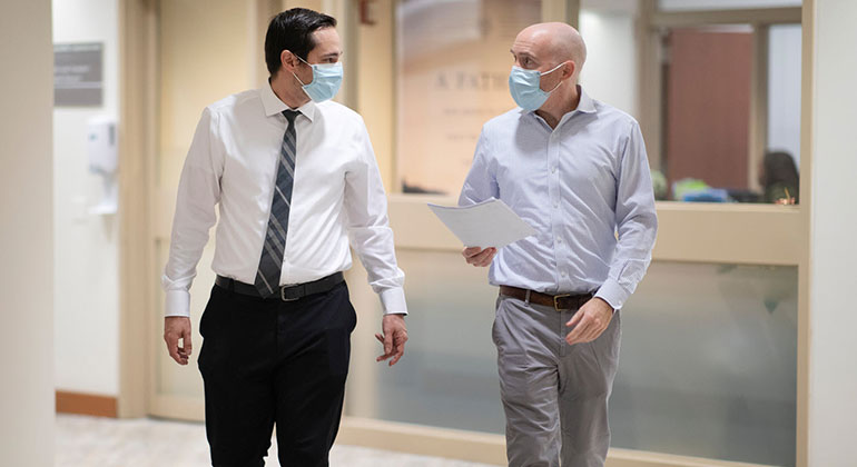 Masked doctors in hallway