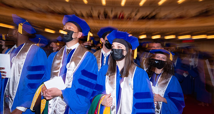 graduating students in cap and gown