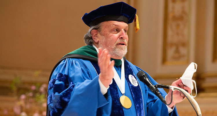 Dean Dennis Charney, MD at the podium during commencement ceremony