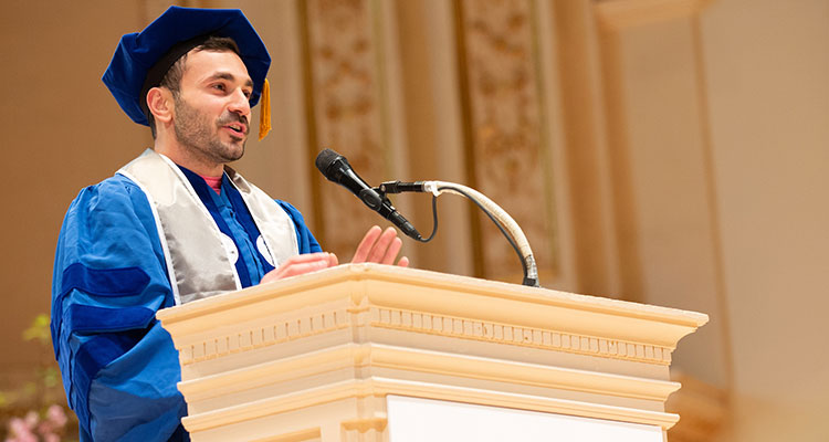 Christopher J. Panebianco at podium during commencement ceremony