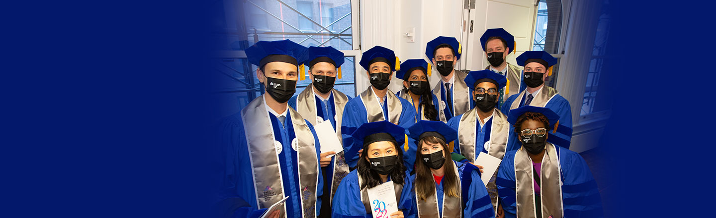 group of graduating students in cap and gown