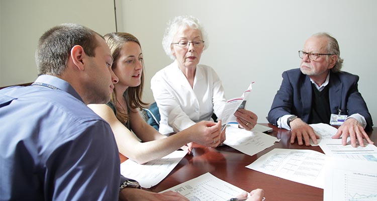 Brain injury team looks over paperwork