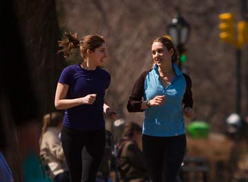 Two students jogging in Central Park together