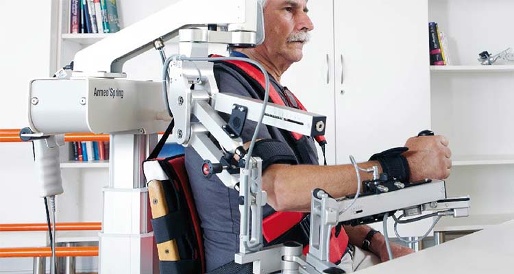 Patient using robotic upper limb